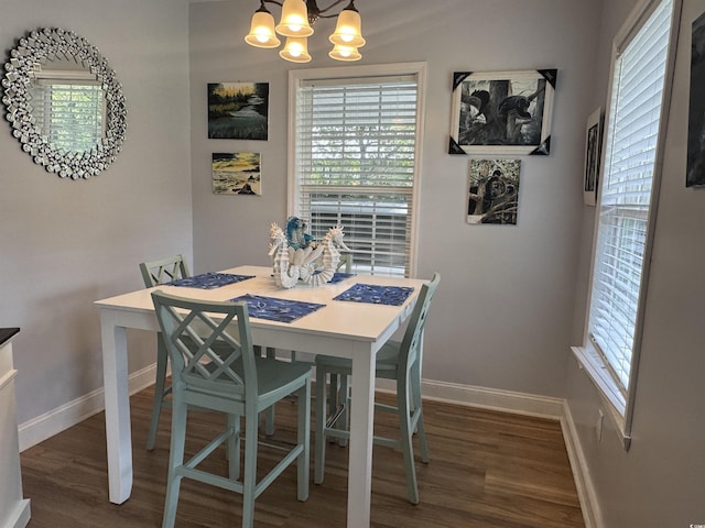 304 S Magnolia Ave, Andrews, SC 29510 - dining room with baseboards, a chandelier, and wood finished floors