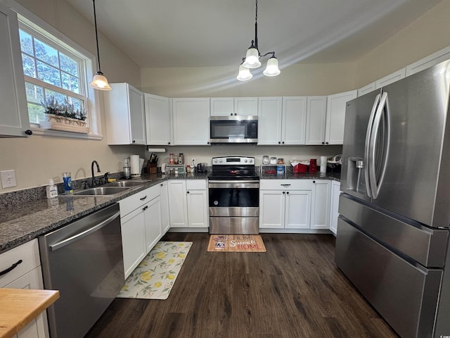 304 S Magnolia Ave, Andrews, SC 29510 - kitchen featuring stainless steel appliances, a chandelier, dark wood finished floors, a sink, and white cabinetry