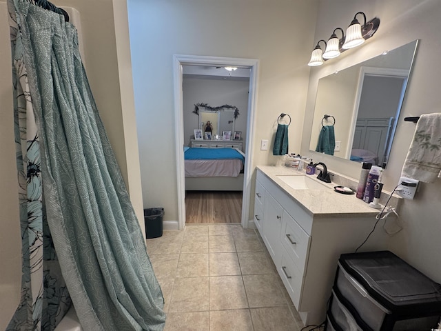 304 S Magnolia Ave, Andrews, SC 29510 - ensuite bathroom with vanity, tile patterned floors, and baseboards
