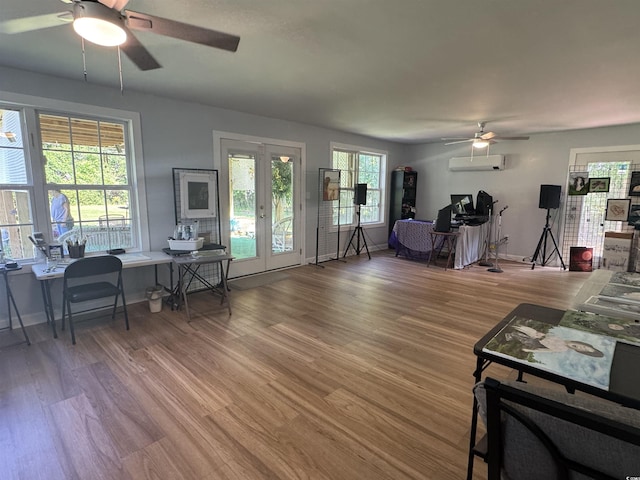 304 S Magnolia Ave, Andrews, SC 29510 - living room featuring a ceiling fan, french doors, an office area, a wall mounted AC, and wood finished floors