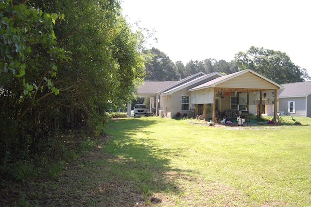 304 S Magnolia Ave, Andrews, SC 29510 - back of house with a yard and a patio area