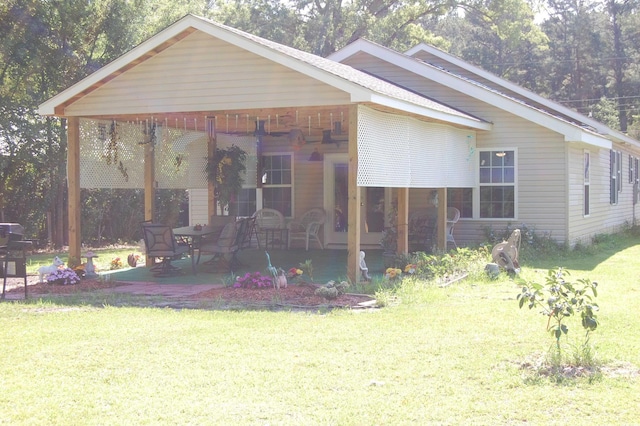 304 S Magnolia Ave, Andrews, SC 29510 - view of front of property featuring a front lawn and a patio
