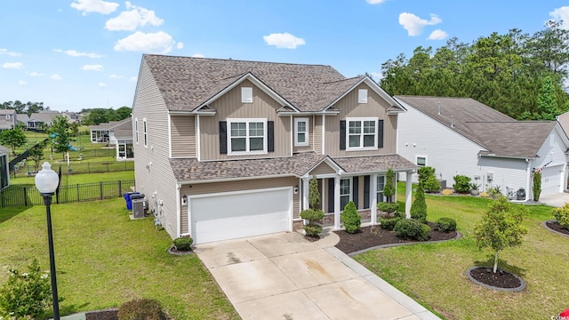 148 Long Leaf Pine Dr, Conway, SC 29526 - view of front facade with concrete driveway, a shingled roof, an attached garage, central air condition unit, and covered porch