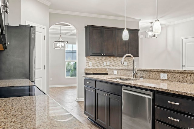 148 Long Leaf Pine Dr, Conway, SC 29526 - kitchen with appliances with stainless steel finishes, a sink, a chandelier, tasteful backsplash, and light wood-style flooring