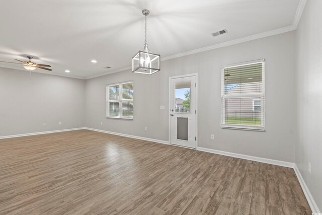 148 Long Leaf Pine Dr, Conway, SC 29526 - spare room featuring wood finished floors, baseboards, crown molding, a ceiling fan, and a chandelier