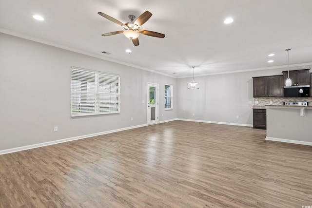 148 Long Leaf Pine Dr, Conway, SC 29526 - unfurnished living room featuring crown molding, a ceiling fan, light wood finished floors, recessed lighting, and baseboards