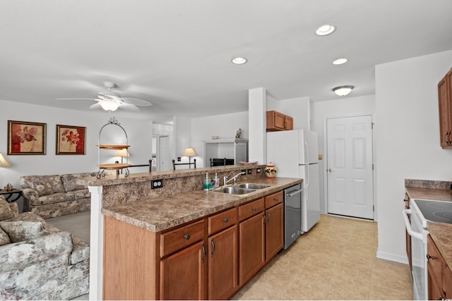 2448 Whetstone Ln, Myrtle Beach, SC 29579 - kitchen with white appliances, open floor plan, a sink, ceiling fan, and brown cabinets
