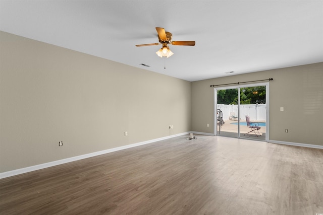 4013 Blackwolf Dr, Myrtle Beach, SC 29579 - spare room featuring wood finished floors, a ceiling fan, and baseboards