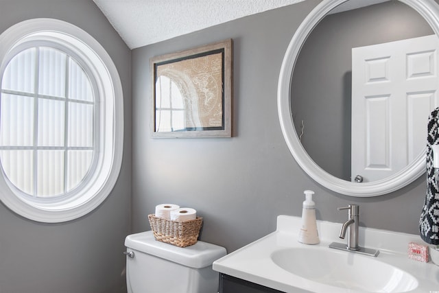 104 Clovis Cir, Myrtle Beach, SC 29579 - bathroom with toilet, vanity, lofted ceiling, and a textured ceiling