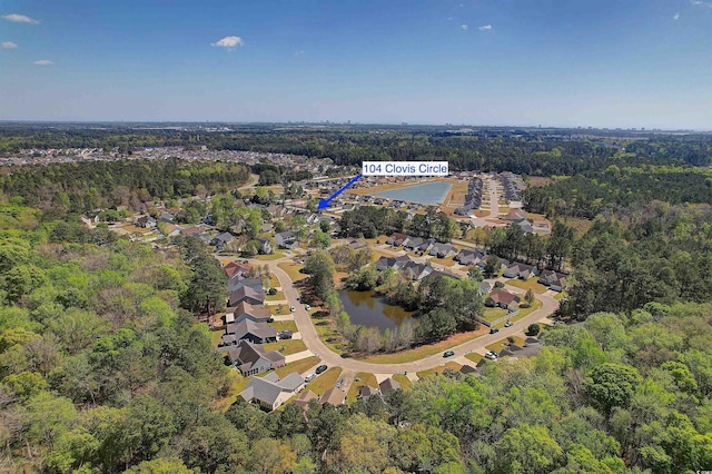 104 Clovis Cir, Myrtle Beach, SC 29579 - view of property location with a heavily wooded area, a large body of water, and nearby suburban area