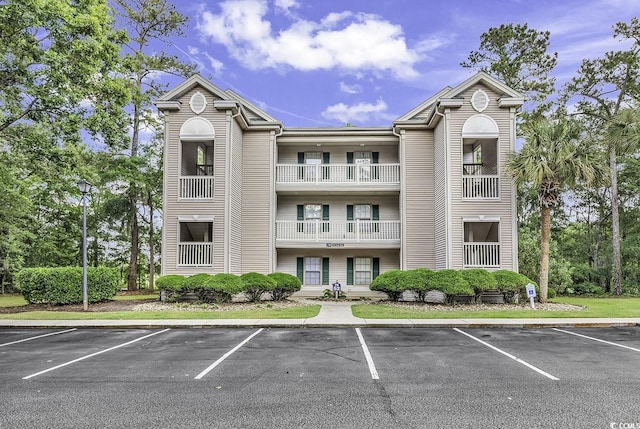 598 Blue Stem Dr Unit 52E, Pawleys Island, SC 29585 - view of building exterior featuring uncovered parking