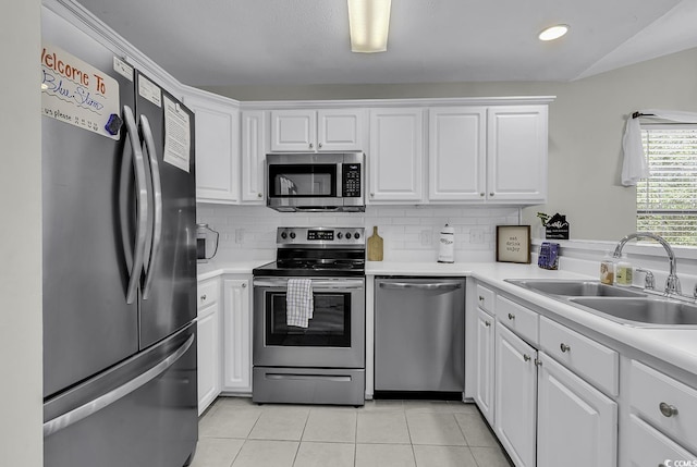 598 Blue Stem Dr Unit 52E, Pawleys Island, SC 29585 - kitchen featuring appliances with stainless steel finishes, a sink, light tile patterned flooring, white cabinetry, and recessed lighting
