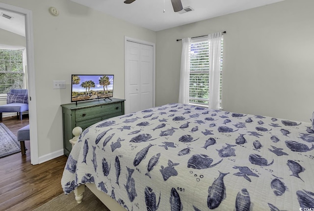 598 Blue Stem Dr Unit 52E, Pawleys Island, SC 29585 - bedroom with dark wood-style floors, a closet, baseboards, and ceiling fan