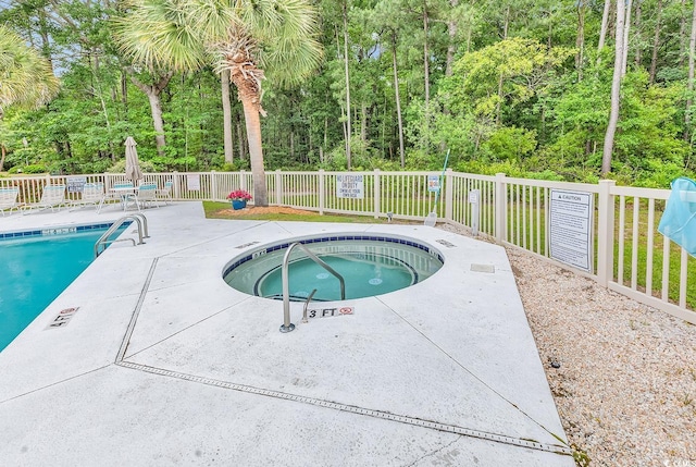 598 Blue Stem Dr Unit 52E, Pawleys Island, SC 29585 - community pool with a hot tub and a patio