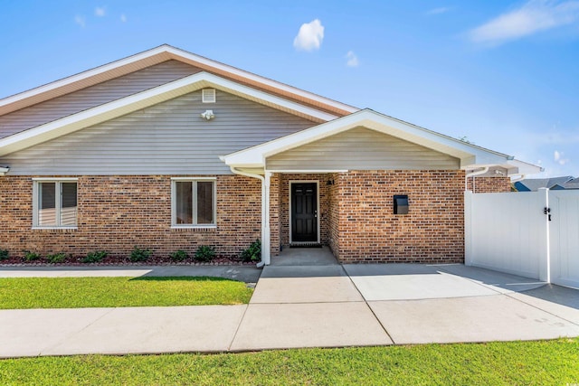 502 Garden Dr, Surfside Beach, SC 29575 - traditional-style house featuring brick siding