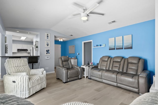 502 Garden Dr, Surfside Beach, SC 29575 - living room featuring vaulted ceiling, light wood-type flooring, ceiling fan, and baseboards