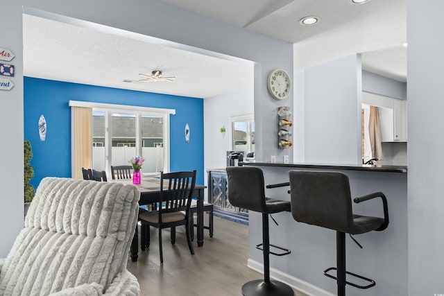 502 Garden Dr, Surfside Beach, SC 29575 - dining area with light wood-style flooring, recessed lighting, ceiling fan, and baseboards