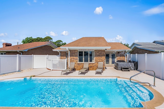 502 Garden Dr, Surfside Beach, SC 29575 - view of pool featuring a hot tub, french doors, a fenced backyard, and a patio