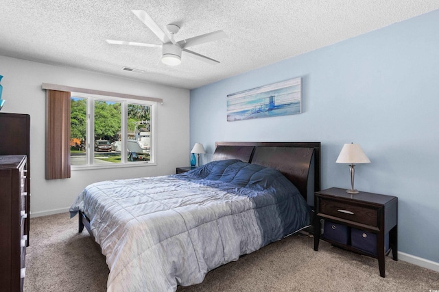 502 Garden Dr, Surfside Beach, SC 29575 - bedroom featuring carpet, baseboards, a textured ceiling, and ceiling fan