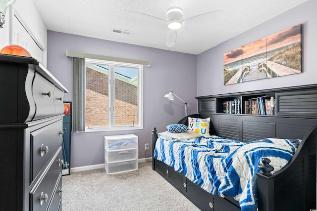502 Garden Dr, Surfside Beach, SC 29575 - carpeted bedroom featuring baseboards, a textured ceiling, and a ceiling fan