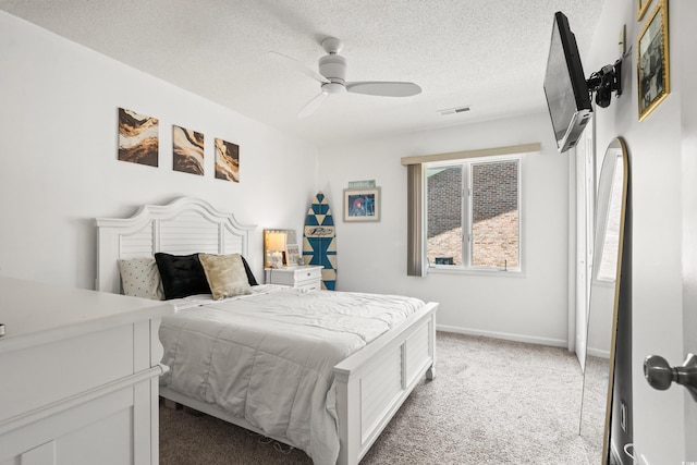 502 Garden Dr, Surfside Beach, SC 29575 - bedroom featuring light carpet, a textured ceiling, a ceiling fan, and baseboards