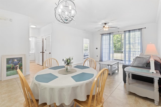 5825 Catalina Dr Unit 124, North Myrtle Beach, SC 29582 - dining room with light tile patterned floors, ceiling fan, crown molding, and a chandelier
