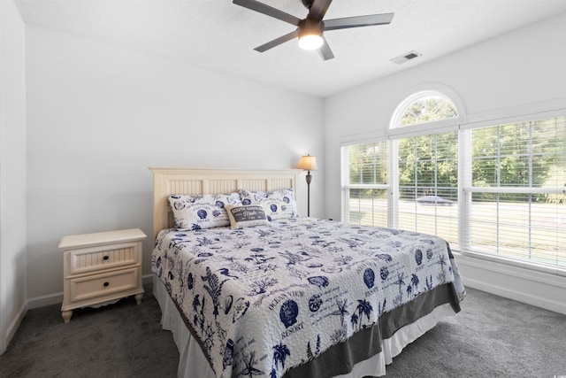 5825 Catalina Dr Unit 124, North Myrtle Beach, SC 29582 - carpeted bedroom with baseboards and a ceiling fan