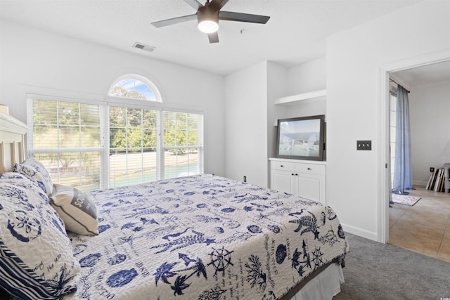 5825 Catalina Dr Unit 124, North Myrtle Beach, SC 29582 - bedroom featuring carpet floors, ceiling fan, tile patterned floors, and baseboards