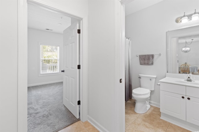 5825 Catalina Dr Unit 124, North Myrtle Beach, SC 29582 - bathroom featuring vanity, toilet, tile patterned floors, and baseboards