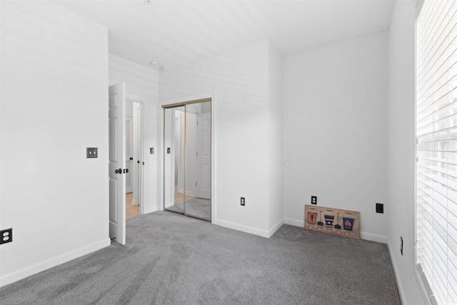 5825 Catalina Dr Unit 124, North Myrtle Beach, SC 29582 - unfurnished bedroom featuring carpet floors, a closet, and baseboards
