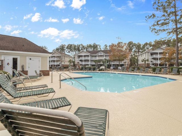 5825 Catalina Dr Unit 124, North Myrtle Beach, SC 29582 - community pool with a patio and a residential view