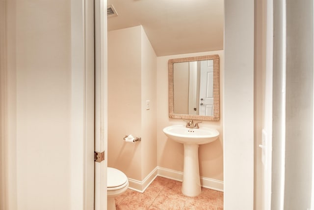 750 Shine Ave Unit 750, Myrtle Beach, SC 29577 - bathroom with toilet, baseboards, and tile patterned flooring