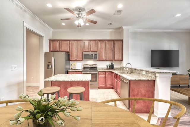 750 Shine Ave Unit 750, Myrtle Beach, SC 29577 - kitchen featuring appliances with stainless steel finishes, a sink, a peninsula, ceiling fan, and ornamental molding
