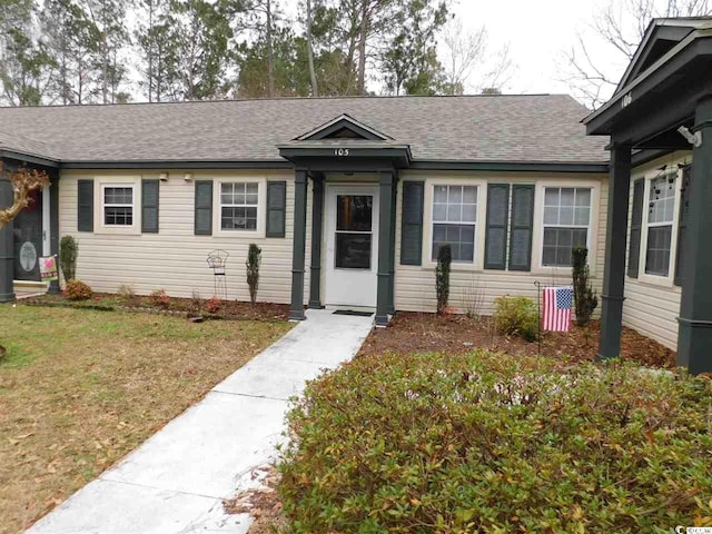 6805 Creekwatch Rd Unit 105, Myrtle Beach, SC 29588 - view of front of property with a shingled roof and a front lawn