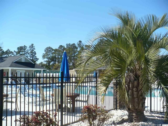 6805 Creekwatch Rd Unit 105, Myrtle Beach, SC 29588 - snow covered pool with a community pool and a patio