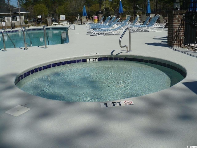 6805 Creekwatch Rd Unit 105, Myrtle Beach, SC 29588 - community pool featuring a community hot tub and a patio area