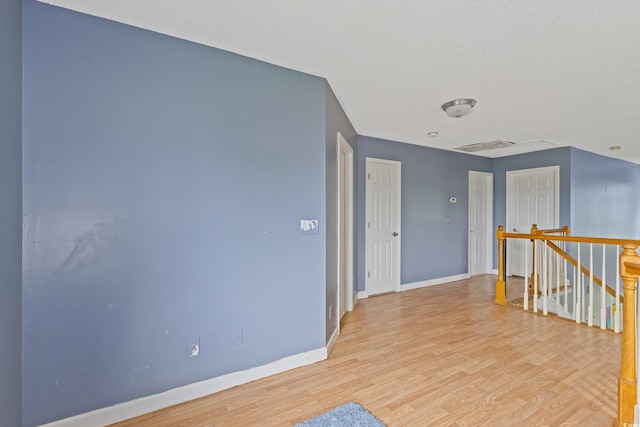 1033 Mccall Loop, Conway, SC 29526 - corridor featuring an upstairs landing, light wood-style floors, and baseboards