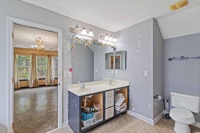 1033 Mccall Loop, Conway, SC 29526 - bathroom featuring double vanity, a textured ceiling, toilet, baseboards, and a chandelier