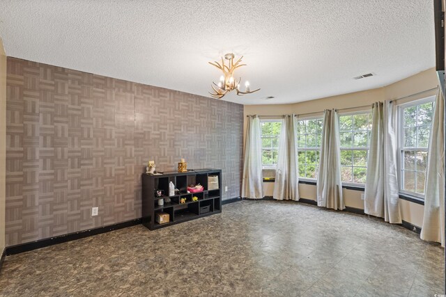1033 Mccall Loop, Conway, SC 29526 - living area with a chandelier, baseboards, healthy amount of natural light, and a textured ceiling
