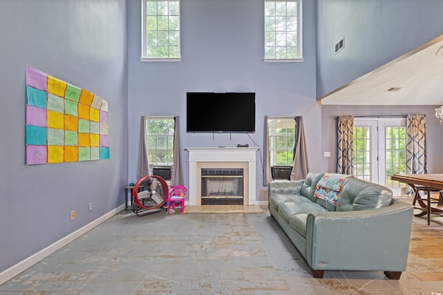 1033 Mccall Loop, Conway, SC 29526 - living area featuring a high ceiling, a fireplace, baseboards, and french doors