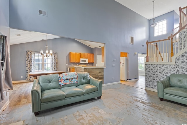 1033 Mccall Loop, Conway, SC 29526 - living room featuring a chandelier, high vaulted ceiling, healthy amount of natural light, and baseboards