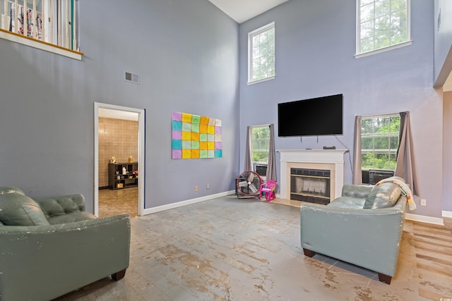 1033 Mccall Loop, Conway, SC 29526 - living area with a high ceiling, baseboards, and a fireplace