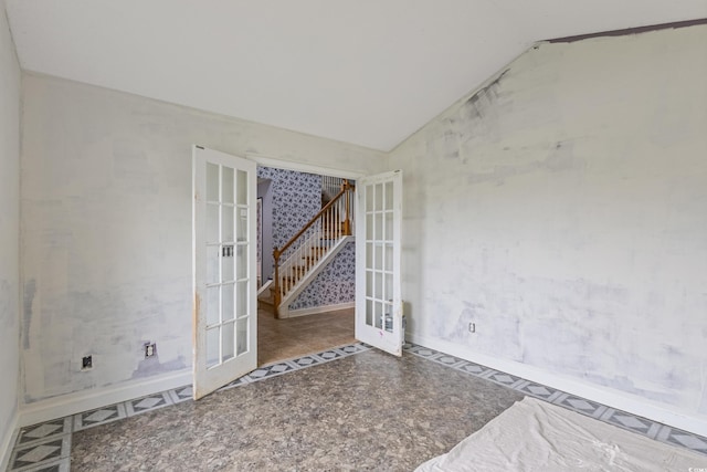 1033 Mccall Loop, Conway, SC 29526 - spare room featuring french doors, vaulted ceiling, baseboards, and stairs