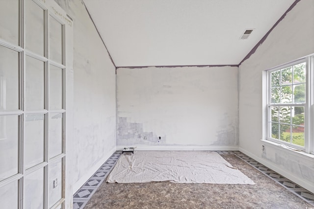 1033 Mccall Loop, Conway, SC 29526 - empty room featuring vaulted ceiling, plenty of natural light, and baseboards