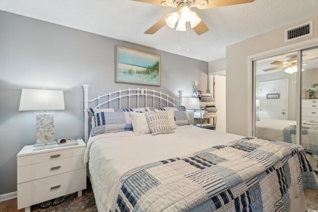 1210 N Waccamaw Dr Unit 1105, Murrells Inlet, SC 29576 - bedroom with a ceiling fan and dark wood-style floors
