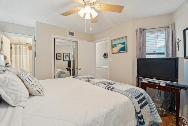 1210 N Waccamaw Dr Unit 1105, Murrells Inlet, SC 29576 - bedroom with ceiling fan, wood finished floors, and a closet