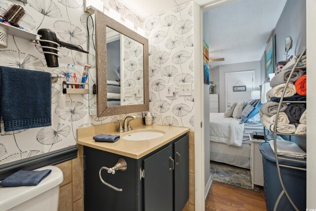 1210 N Waccamaw Dr Unit 1105, Murrells Inlet, SC 29576 - bathroom with ensuite bath, vanity, toilet, and wood finished floors