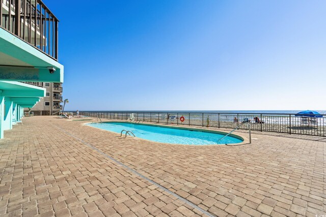 1210 N Waccamaw Dr Unit 1105, Murrells Inlet, SC 29576 - community pool featuring a patio and a water view