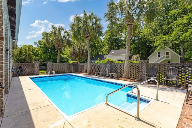 1140 Waterway Ln, Myrtle Beach, SC 29572 - view of swimming pool featuring a patio area and view of scattered trees