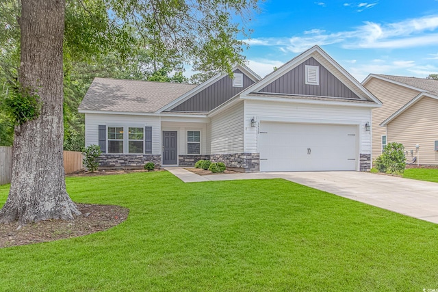 3539 Harrelson Ave, Loris, SC 29569 - view of front of property featuring board and batten siding, stone siding, an attached garage, and concrete driveway